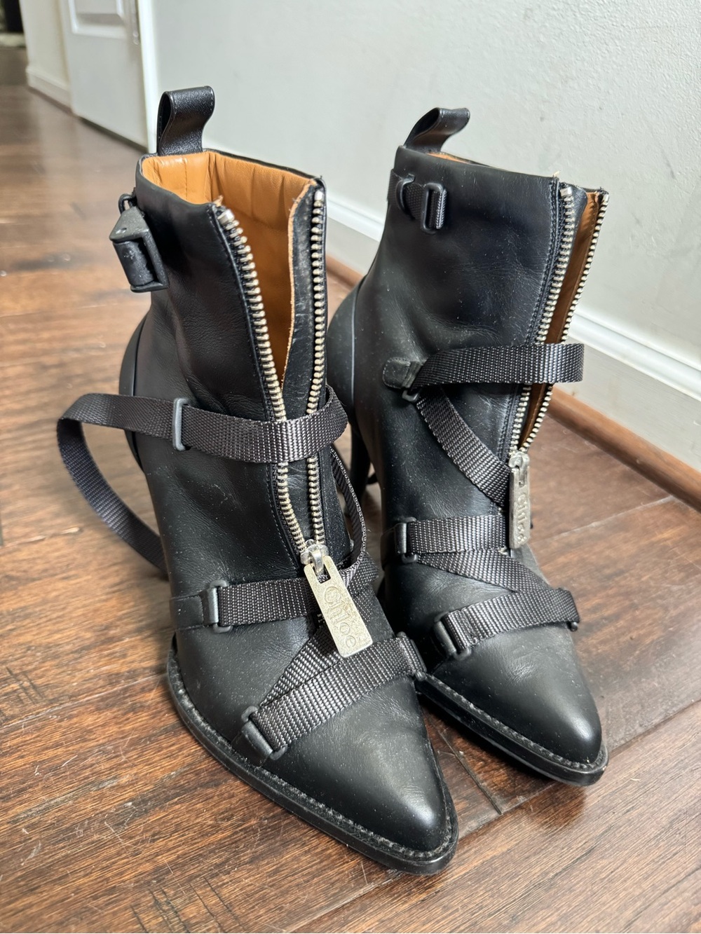 Chloe Black Pointed-Toe Ankle Booties with Front Zipper and Strap Detail